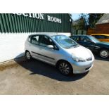 A Honda Jazz, registration FG57 KDO, silver, battery flat, last recorded mileage at service on 7/