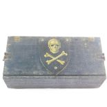 A magician's wooden box, containing conjuring tricks, jokes, etc., the lid bearing a shield with