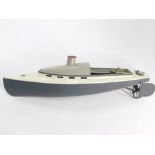 An early 20thC steam driven metal framed model motor cruiser, painted in grey and white, 50cm wide.