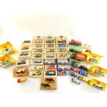 Corgi Lledo and other die cast vintage trucks, sports cars and horse drawn vehicles, all boxed. (1