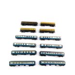 Hornby OO gauge coaches, BR blue and white livery, three Tri-ang coaches and a GW Capital wagon. (