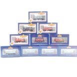 Ten Bachmann OO gauge tank wagons, comprising four ventilated vans and six open wagons. (boxed)