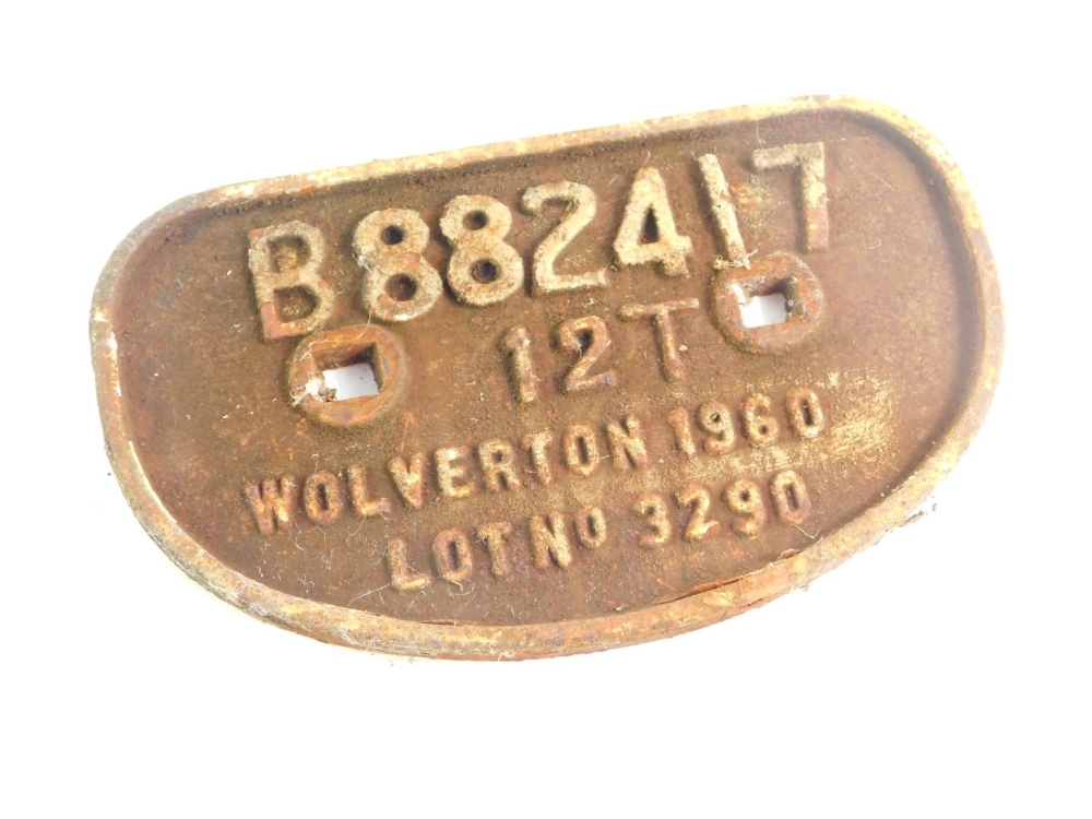 A cast iron wagon plaque, white paint high relief, 'B882417, 12T, Wolverton 1960, Lot No 3290'.,