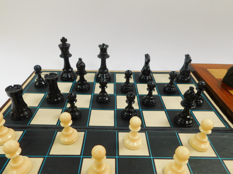 A replica resin Lewis chess set, with a wooden chess board, 47cm diameter, together with a plastic - Image 5 of 5