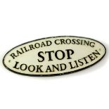 A cast iron railway sign, black painted high relief, 'Railroad Crossing, Stop, Look And Listen'.,