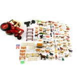 A diecast International 1086 tractor, together with plastic farm yard animals, fencing, further