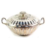 A George III silver twin handled porringer and cover, of fluted form, maker's initials T H, London