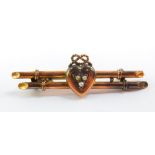 A Victorian seed pearl set heart shaped bar brooch, stamped 9ct, cased, 2.9g.