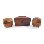 A Victorian flamed mahogany sarcophagus tea caddy, and a pair of Teopani barrel shape oak