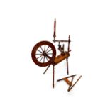 A 19thC oak and beech spinning wheel, 112.5cm high, 78cm wide.