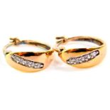 A pair of cubic zirconia set hoop earrings, in yellow metal stamped 925.