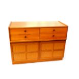 A Nathan teak sideboard, with four drawers over a pair of cupboard doors, raised on a plinth base,