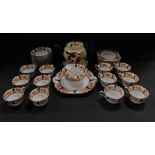 An early 20thC Tuscan porcelain tea service, decorated with flowers, comprising a pair of bread