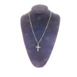 A 9ct gold crucifix pendant on a curb link neck chain, 8.5g.