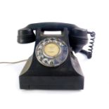 A black Bakelite GEC telephone with a Wisbech number.