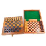 A Jacques Type travelling chess set, with a folding board box, 18cm diameter, one rook lacking,