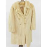 A Calman Links white mink fur coat. On initial inspection there is no size given, the coat smells