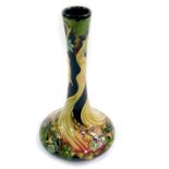 A Moorcroft pottery limited edition vase, decorated in the Wood Nymph pattern, of bottle form,