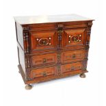 A Continental 17thC and later oak and walnut chest, of two short over two long drawers, raised on