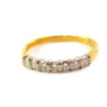 An 18ct gold and diamond half hoop eternity ring, set with seven brilliant cut diamonds, approx 0.