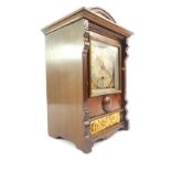 A French early 20thC oak cased mantel clock, square brass dial with foliate spandrels, silver