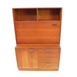 A G Plan style 1970's teak lounge cabinet, with two recesses above a fall flap, opening to reveal