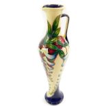 A Moorcroft pottery jug, decorated in the Wsiteria pattern by Phillip Gibson, limited edition 22/