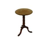 A Victorian mahogany tilt top occasional table, the circular top raised on a turned column over