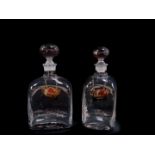 Two Dartington Crystal decanters, with plain globular stoppers, and silver brandy and whisky labels,