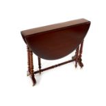 A Victorian mahogany Sutherland table, raised on turned legs united by a turned stretcher, on