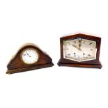 An Art Deco oak mantel clock, with hexagonal dial and eight day movement striking on a gong and a