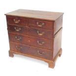 A George III oak chest, of two short over three long graduated drawers, raised on bracket feet, 91cm