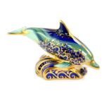 A Royal Crown Derby paperweight modelled as a baby bottle nosed dolphin, second, 11.5cm wide.