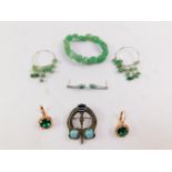 A Miracle Celtic knot brooch, green hard stone bracelet and earring set and two pairs of paste