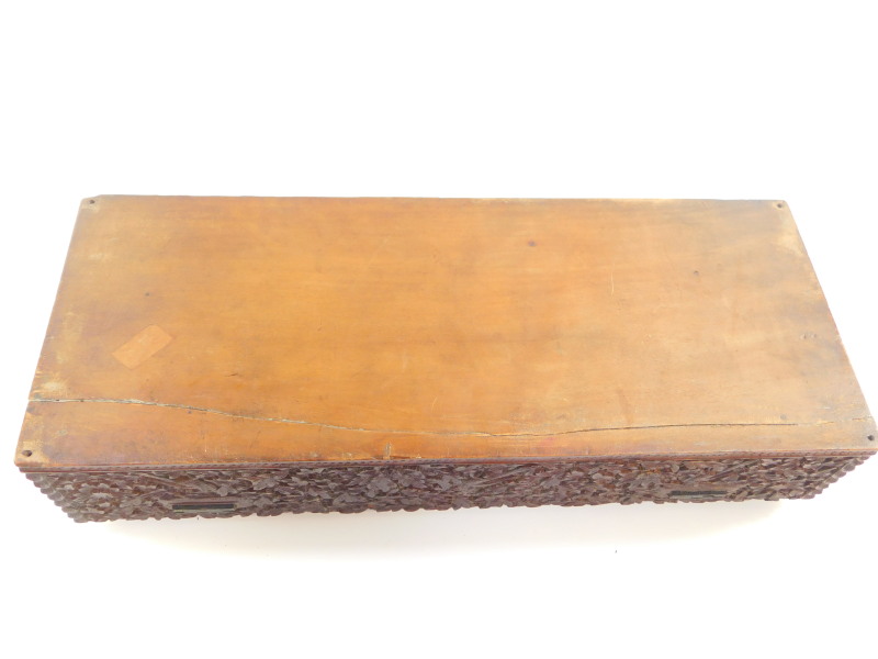 An Anglo Indian 19thC hardwood box, of rectangular form, carved with a recumbent deity, temples, - Image 7 of 7