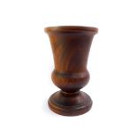 A large walnut treen bell shaped vase, 14cm high.