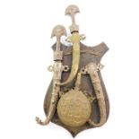 An Ottoman Turkish brass powder flask, a Turkish dagger with a white metal hilt and sheath,