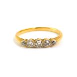 A diamond five stone ring, set in yellow metal, approx 0.25cts, size N, 2.0g.