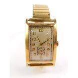 A Hefik gentleman's 9ct gold cased tank wristwatch, the rectangular dial bearing Arabic numerals,