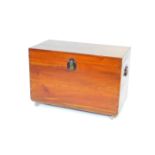 A teak chest, with cast iron handles and lock plate, opening to reveal a tray insert, raised on