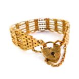 A 9ct gold six bar gate bracelet, on a heart shaped padlock clasp, with safety chain as fitted, 38.