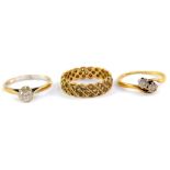 A gold and diamond two stone ring, in a crossover setting, size N, 9ct gold and cubic zirconia