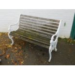 A Victorian style slatted garden bench, with cast iron scrolling supports.