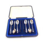A set of six George V silver teaspoons and a pair of sugar tongs, Sheffield 1917, 2.80oz.