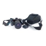A Minolta Maxum 7000I camera, with a Sigma zoom lens 28-70mm, 1:28, 072, cased.