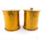 A pair of WWI trench art tobacco jars and covers formed from German shell cases, of cylindrical form