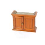 A Victorian wall mounted cabinet, with two doors opening to reveal a single shelf, raised on a