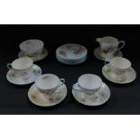 A Shelley porcelain part tea service decorated in the Wild Flowers pattern, comprising cream jug,