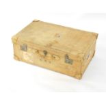 A vintage mid 20thC pig skin suitcase bearing initials KMH, traces of shipping labels including
