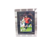 Manchester Utd Interest. A signed coloured photograph of Nemanja Vidic, framed and glazed, with